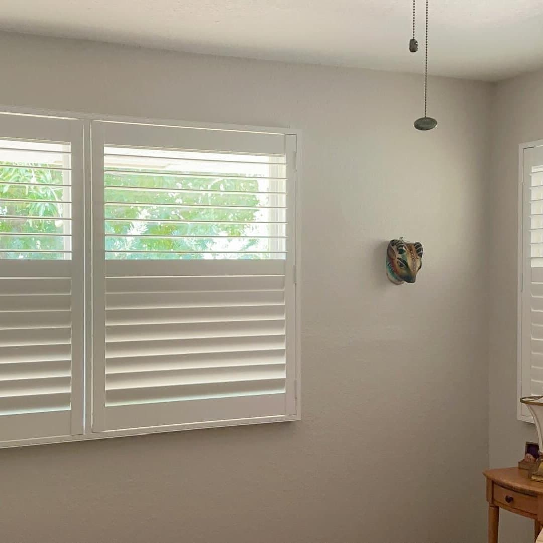 Plantation shutters installed in a South Florida bedroom